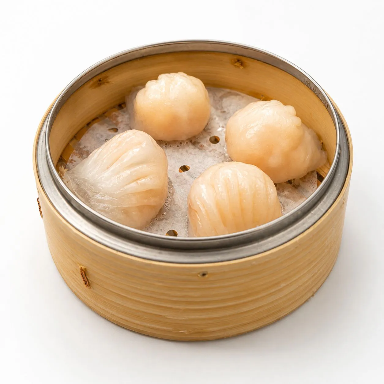 Translucent prawn dumplings served in bamboo steamer