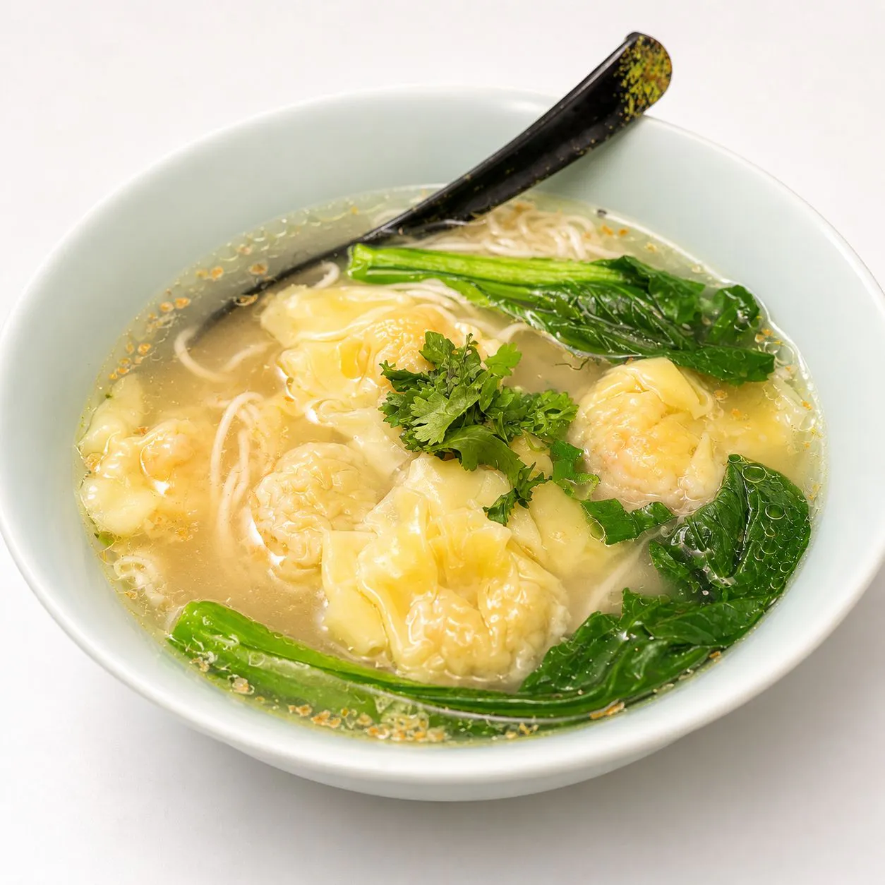 Wonton soup noodle with greens and fresh herbs